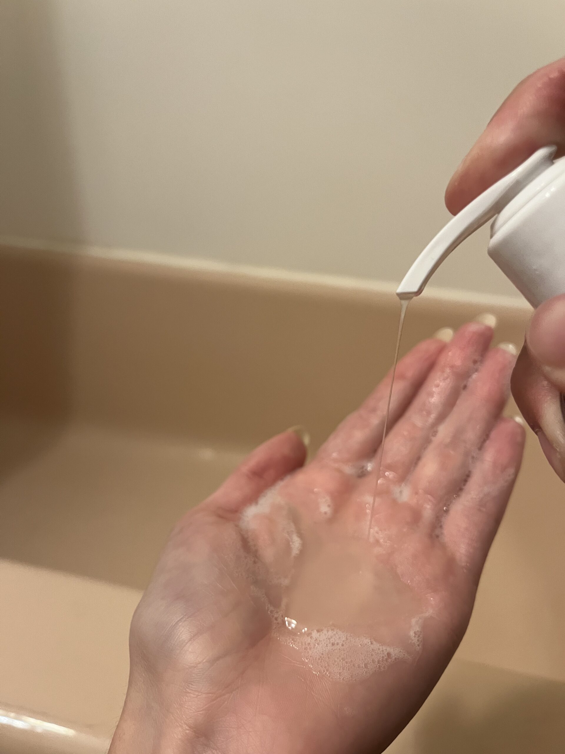 Ceremonia shampoo being poured into a hand