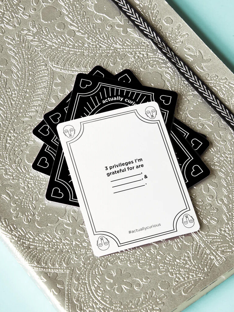 A set of black and white cards on a table.