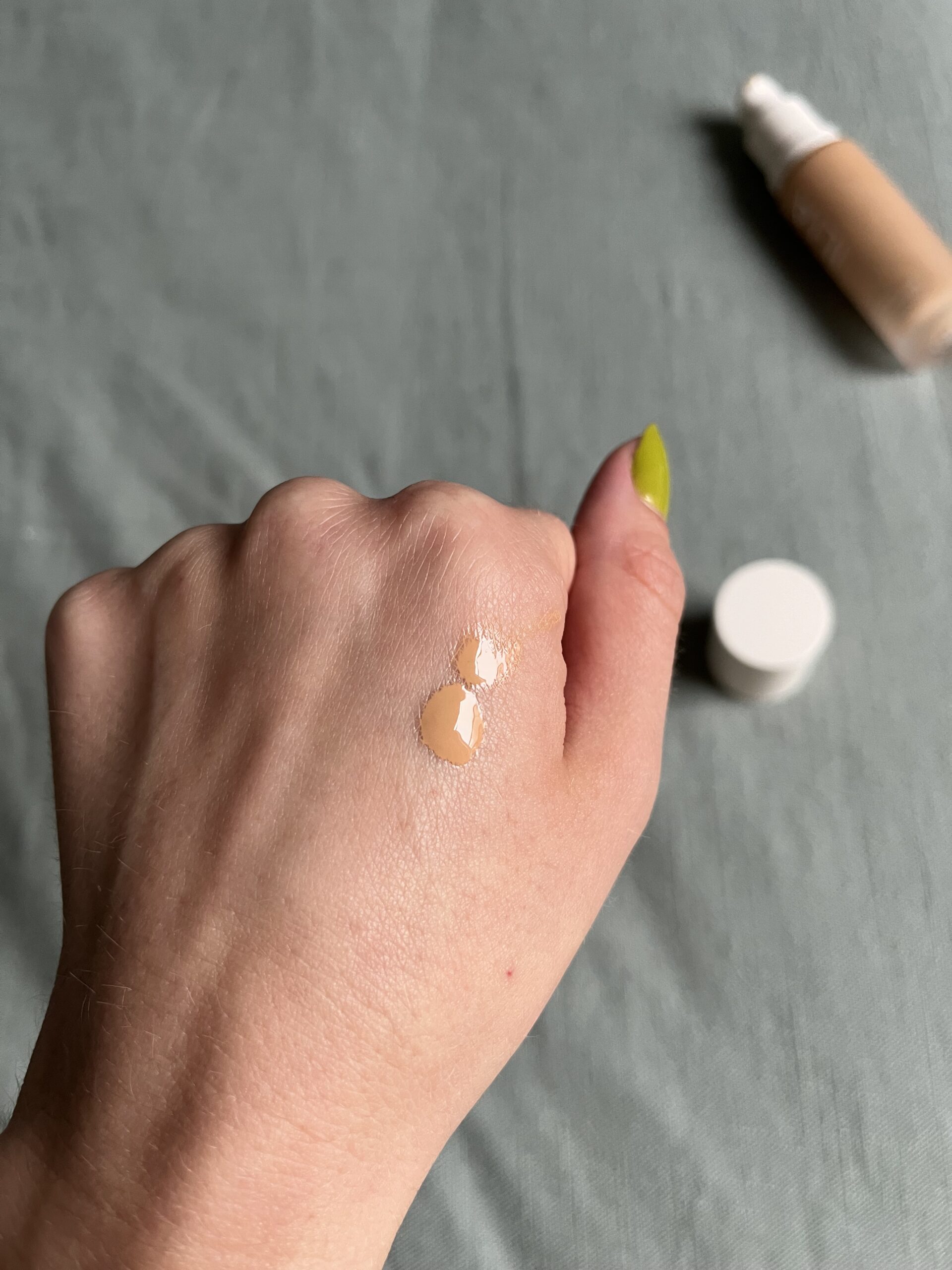 A sample of Ilia foundation on the back of a hand.