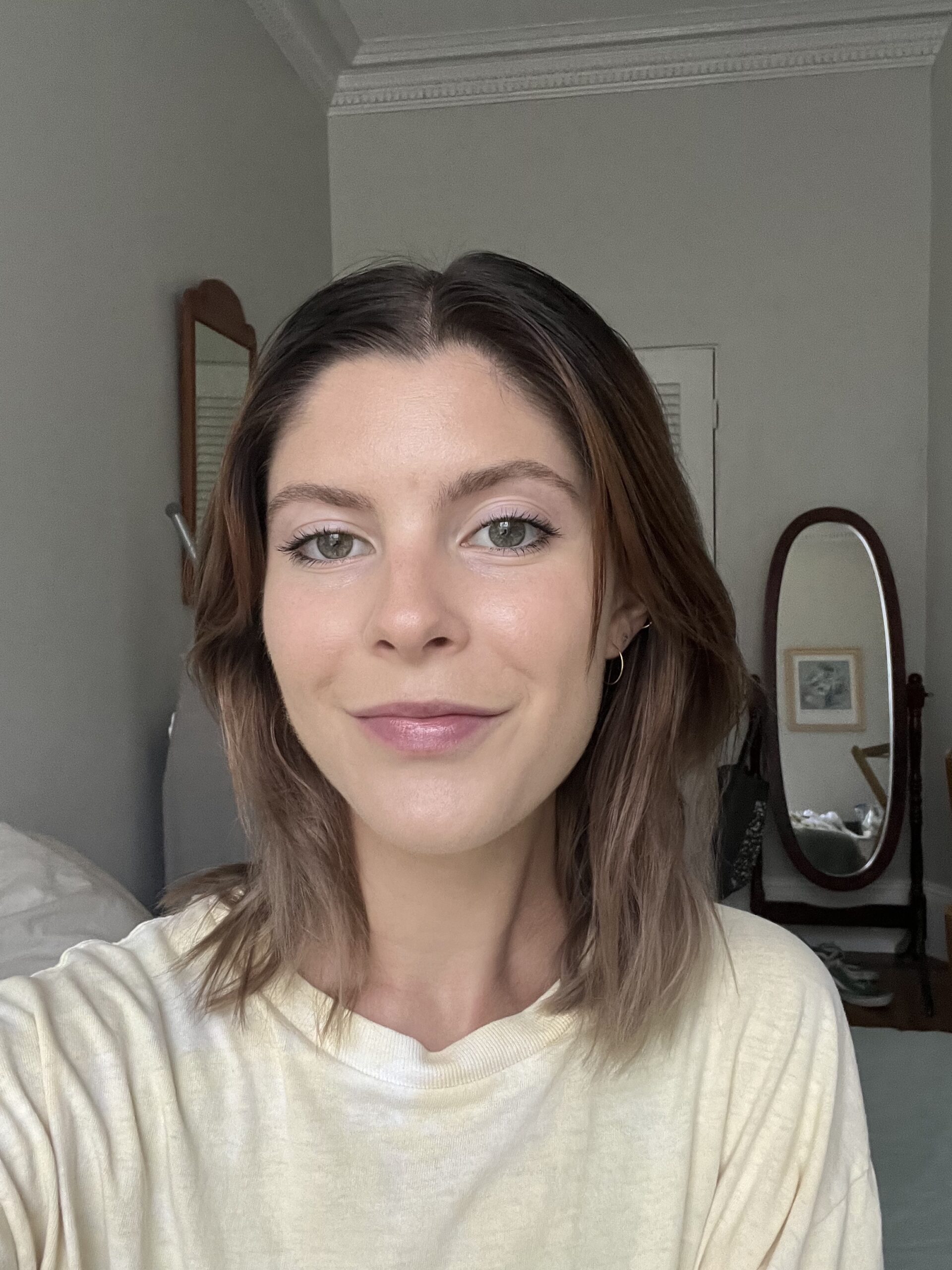 A woman wearing Kosas foundation.