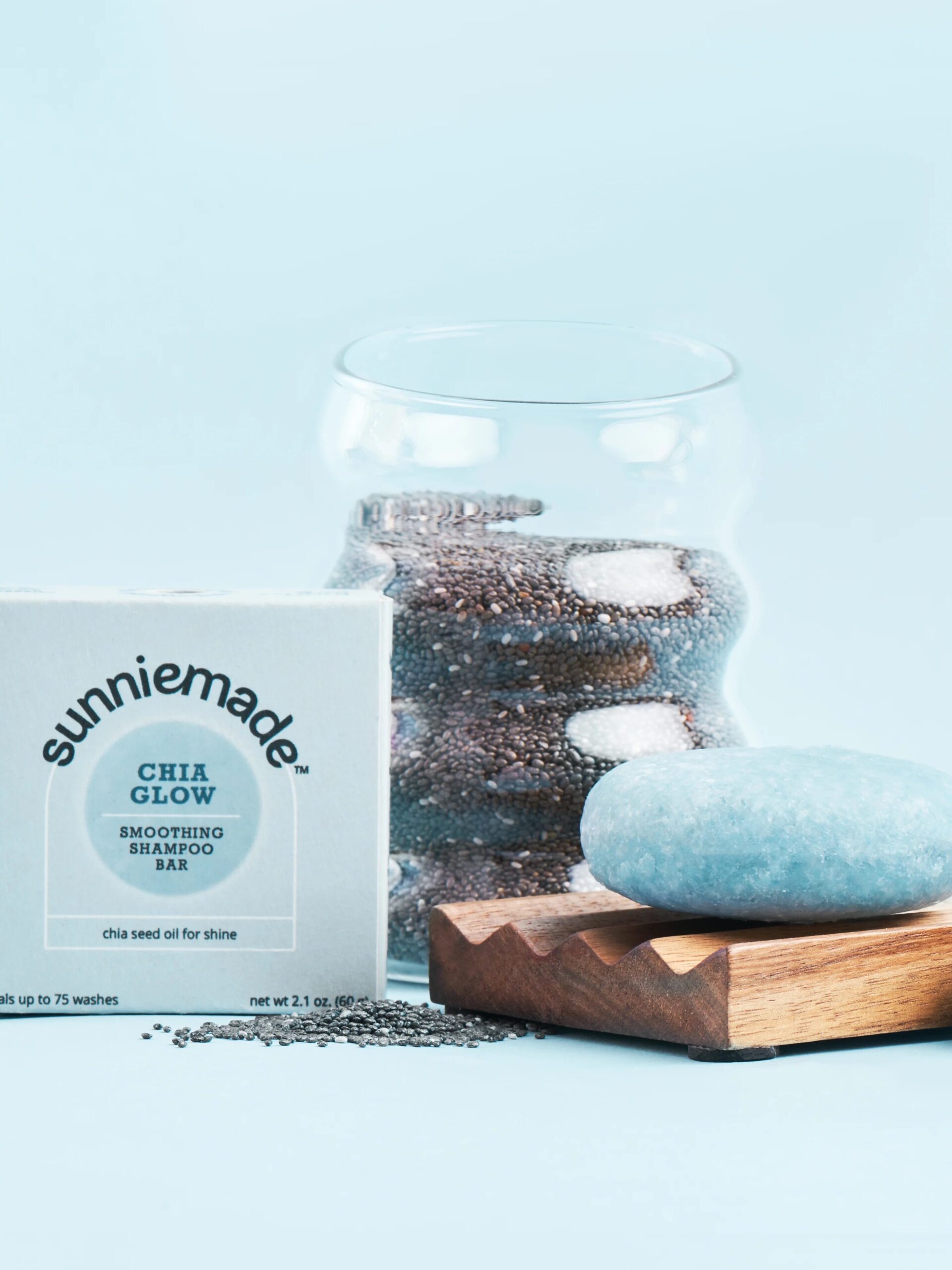 A Sunniemade Chia Glow shampoo bar next to it's packaging and ingredients. 