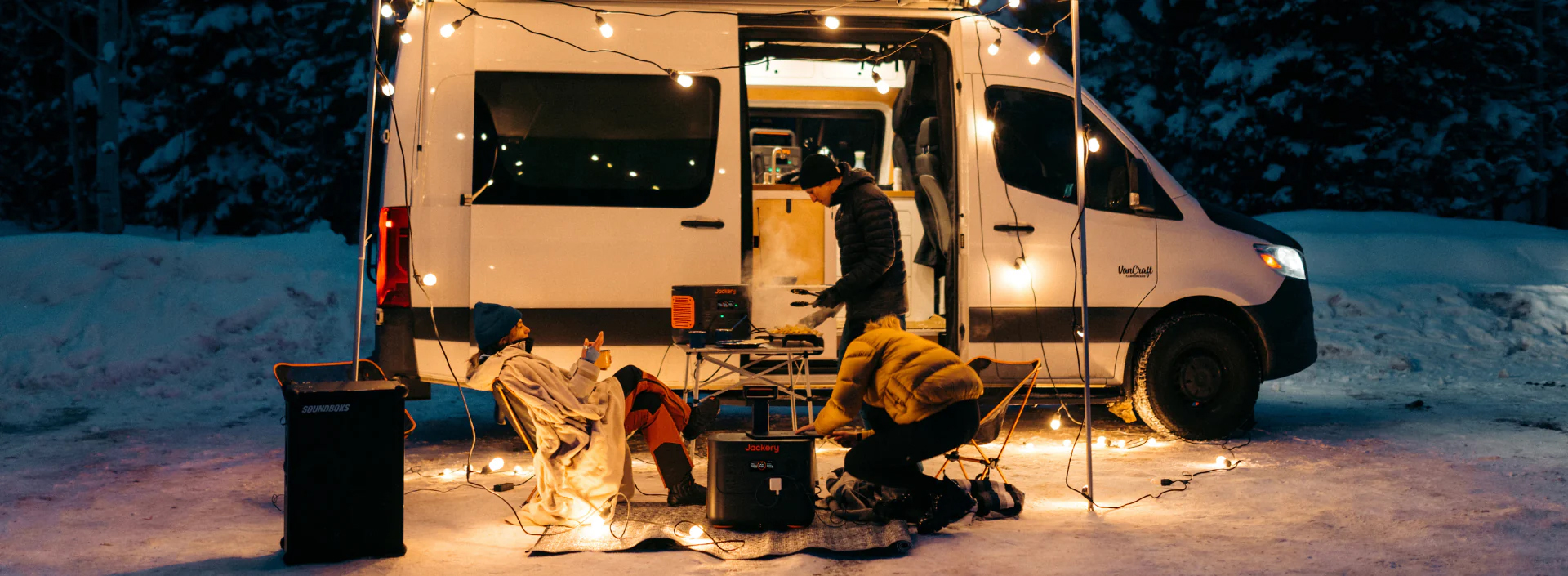 A Jackery solar generator powering a party at a camper.