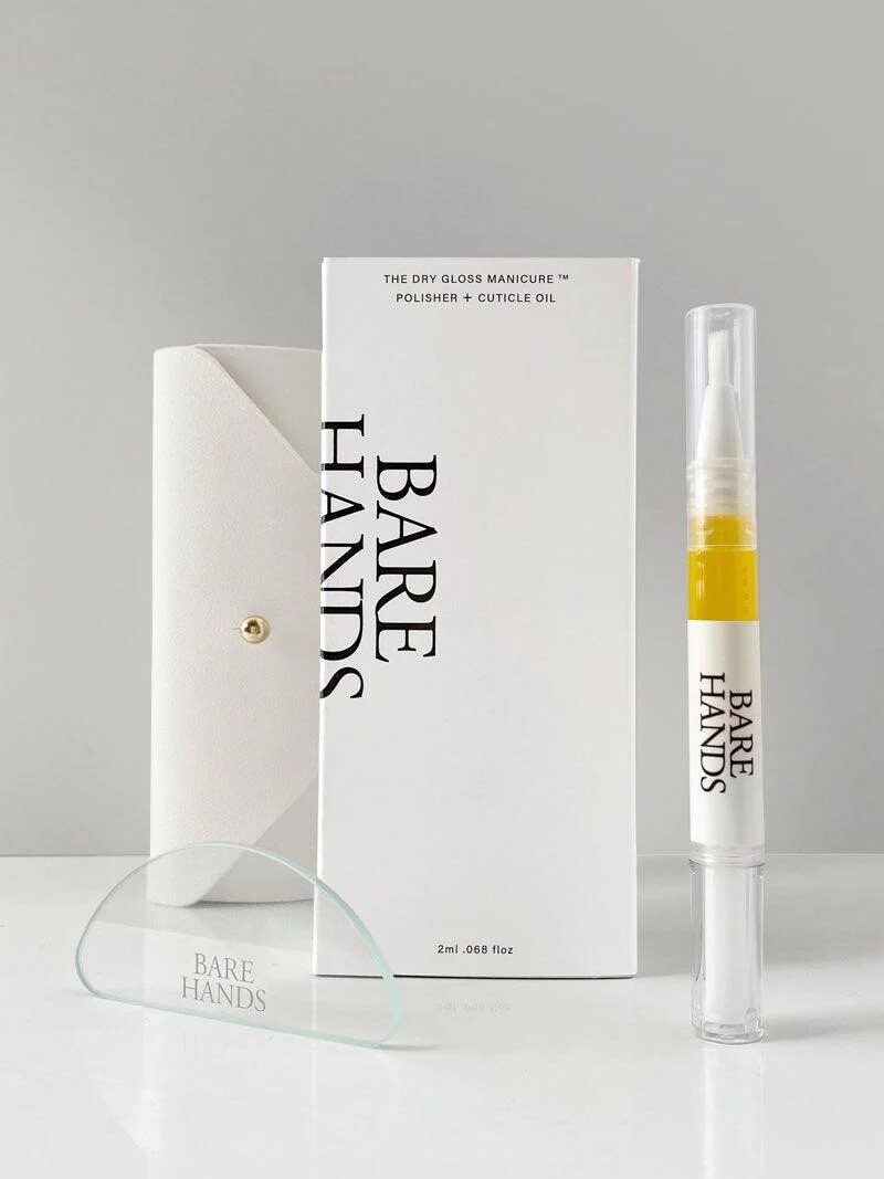 A Bare Hands manicure kit includes a glass nail polisher, a white case, cuticle oil pen, and boxed packaging, all displayed on a white surface.