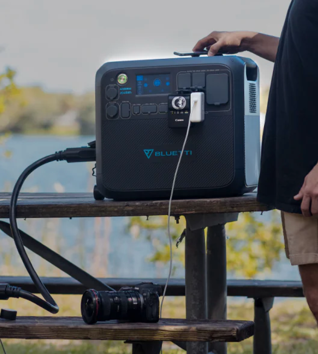 A Bluetti solar generator sitting outside on a table.