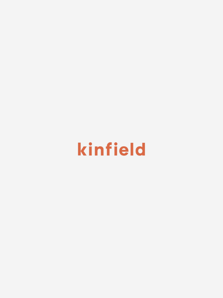 The image displays the word "kinfield" in orange lowercase letters centered on a white background.