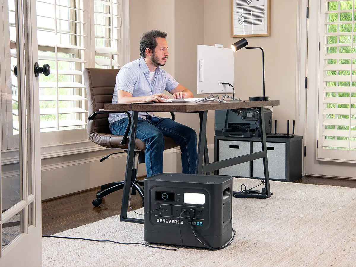 A Geneverse solar generator powering a person's home office.